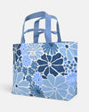 Blue floral coastal-inspired washable paper blue and white patterned tote bag on a light gray background