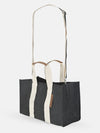 Boxy Tote Mini With Detachable Crossbody Strap in black with cream handles and snap closure for hands-free carry.