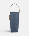 Out of the Woods Navy washable paper reusable wine tote with a brown washable paper handle on a white background