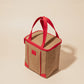 Brown and red eco-friendly structured lunch cooler with dual handles and flat base on beige background