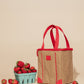 Chill Zone Lunch Cooler with red handles, eco-friendly design, shown next to fresh strawberries on beige background.