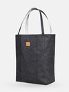 Angle view of the black Iconic Shopper tote bag