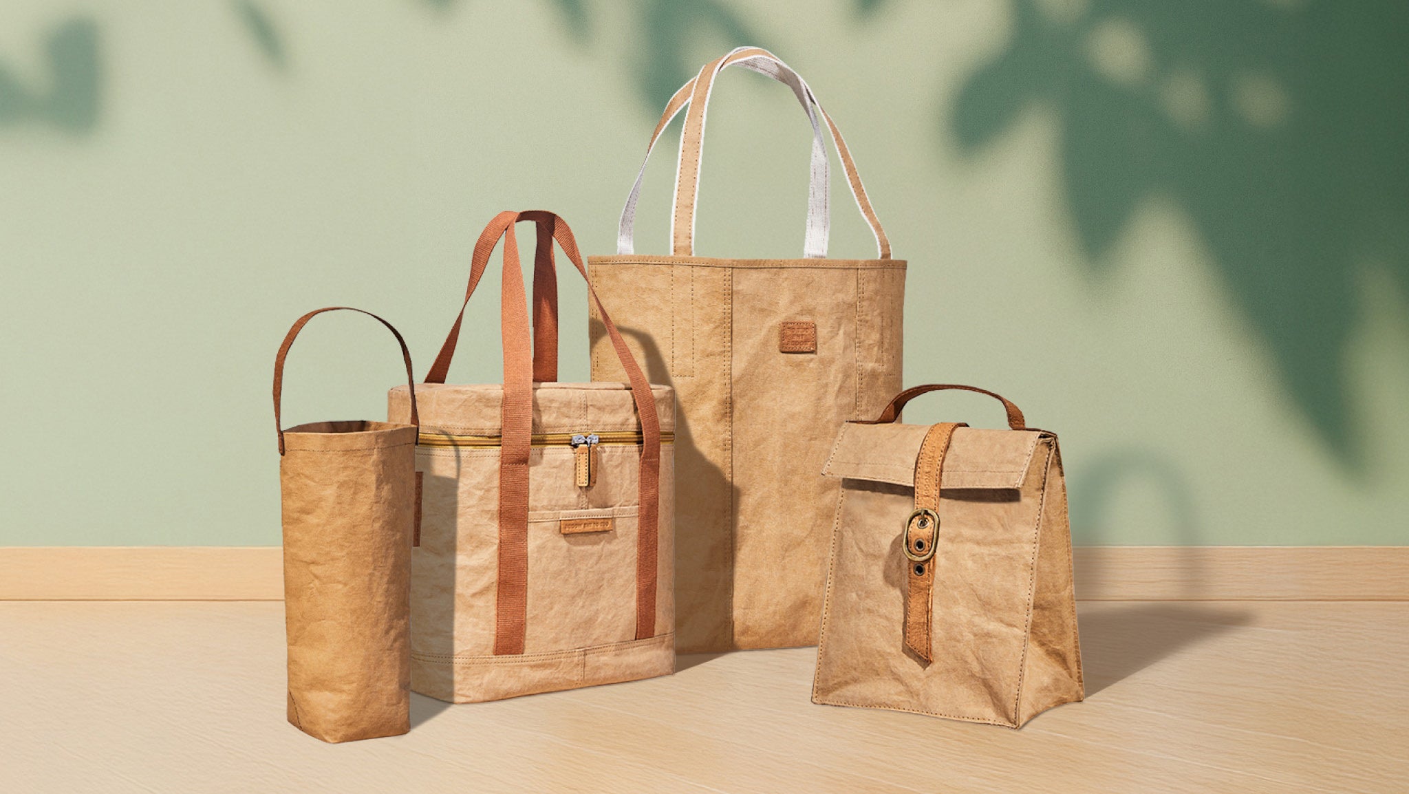 Set of eco-friendly reusable bags in natural tones displayed on a wooden surface with soft green background