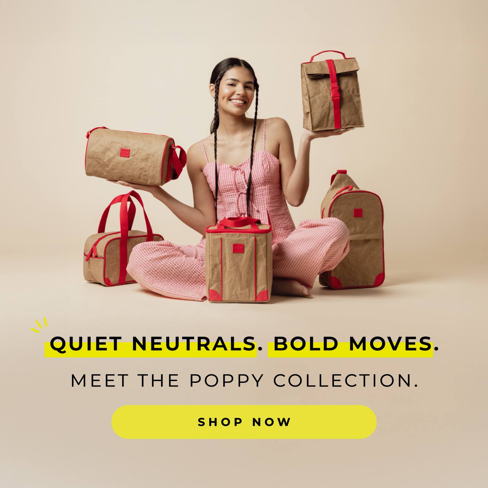 Smiling woman in pink outfit sitting surrounded by neutral brown bags with red accents in a minimalist setting