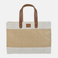 Spacious jute market tote with sturdy brown handles and natural fabric, perfect for carrying everyday essentials.