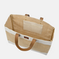 Open view of spacious jute market tote with sturdy leather handles and inner pocket against white background