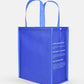 Shopper with Click N' Stay® Large blue reusable bag made from recycled ocean plastic with printed white text on side.