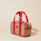 Compact water-resistant lunch cooler with red straps and side pockets, perfect for easy grab-and-go use.