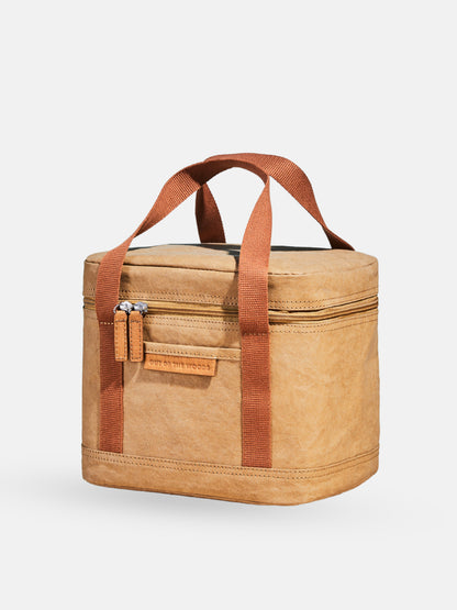 Walrus Lunch Cooler in tan with brown handles, insulated compact lunch bag with zippered pockets and sturdy design.