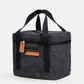 Walrus Lunch Cooler in black with dual handles, zippered pockets, and insulated compact design for school or work use.